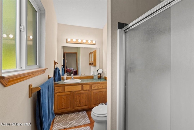 2101 W Bordeaux Ave, Hayden, ID 83835 - bathroom with a shower stall, toilet, and vanity