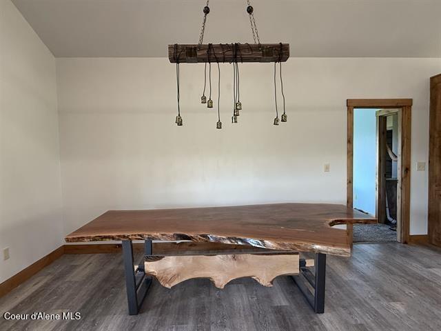240 Canyon Dr, Kooskia, ID 83539 - unfurnished dining area featuring wood finished floors and baseboards