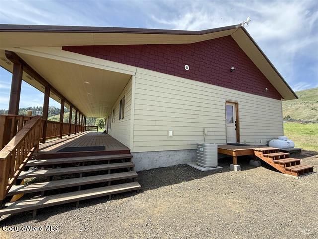 240 Canyon Dr, Kooskia, ID 83539 - view of side of home with central AC unit