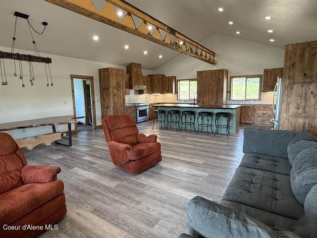 240 Canyon Dr, Kooskia, ID 83539 - living area featuring high vaulted ceiling, light wood finished floors, and recessed lighting