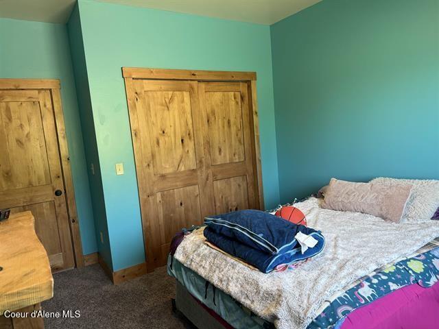 240 Canyon Dr, Kooskia, ID 83539 - bedroom featuring carpet and baseboards