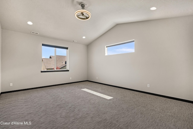 6568 N Downing Ln, Coeur Dalene, ID 83815 - carpeted empty room with healthy amount of natural light, lofted ceiling, recessed lighting, and baseboards