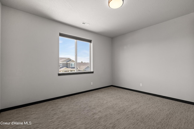 6568 N Downing Ln, Coeur Dalene, ID 83815 - empty room featuring carpet flooring and baseboards