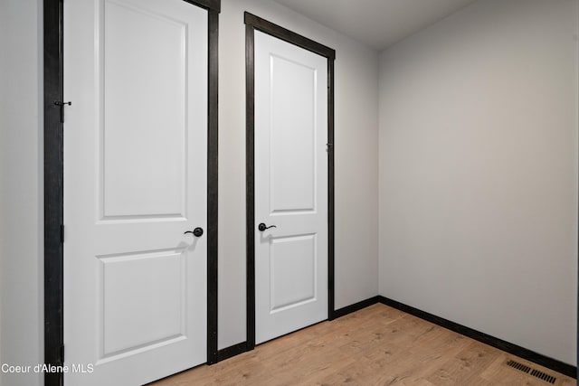 6568 N Downing Ln, Coeur Dalene, ID 83815 - unfurnished bedroom with light wood-style flooring and baseboards