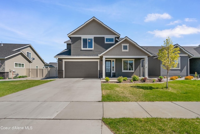 6568 N Downing Ln, Coeur Dalene, ID 83815 - craftsman-style house with driveway, an attached garage, and a porch
