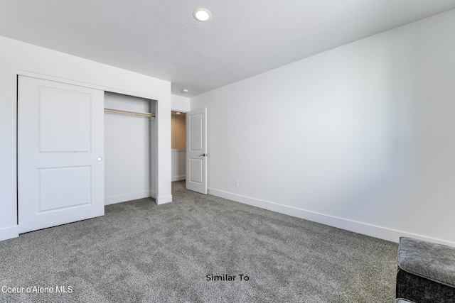 701 N Creative Way, Post Falls, ID 83854 - unfurnished bedroom featuring carpet, a closet, baseboards, and recessed lighting