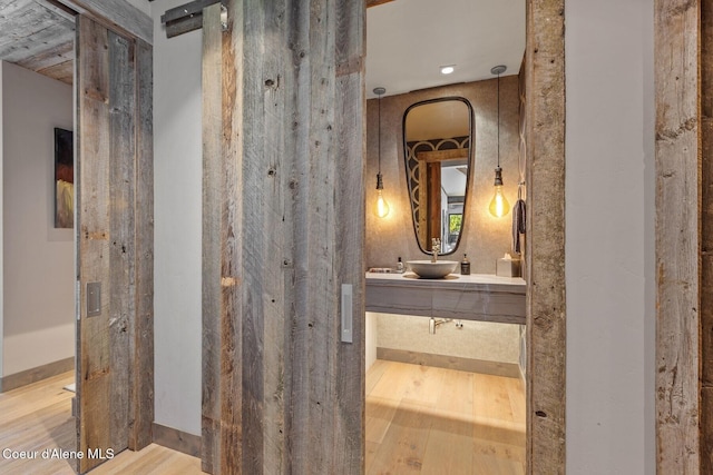 20890 S Inspiration Trl, Harrison, ID 83833 - bathroom with wood finished floors and double vanity