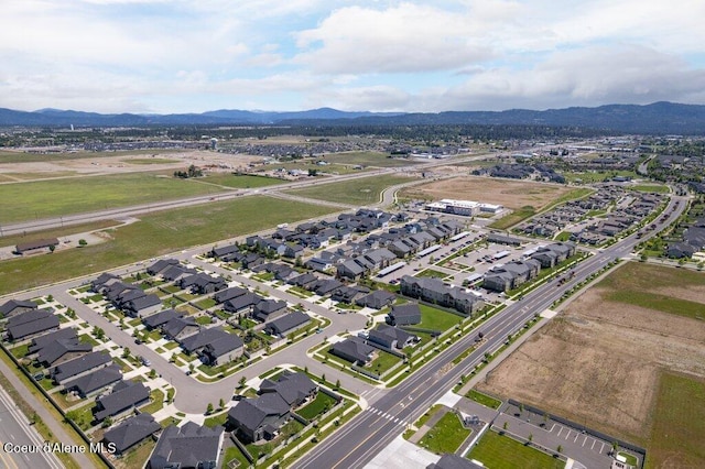 4615 N Connery Loop, Post Falls, ID 83854 - aerial view of property and surrounding area featuring a mountain backdrop and nearby suburban area