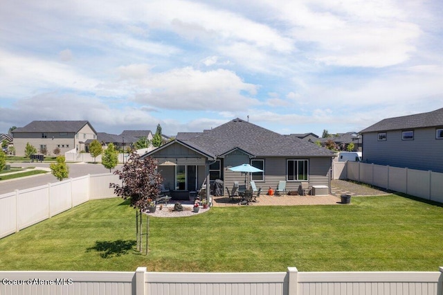 4615 N Connery Loop, Post Falls, ID 83854 - back of property with a patio area, a residential view, and a shingled roof