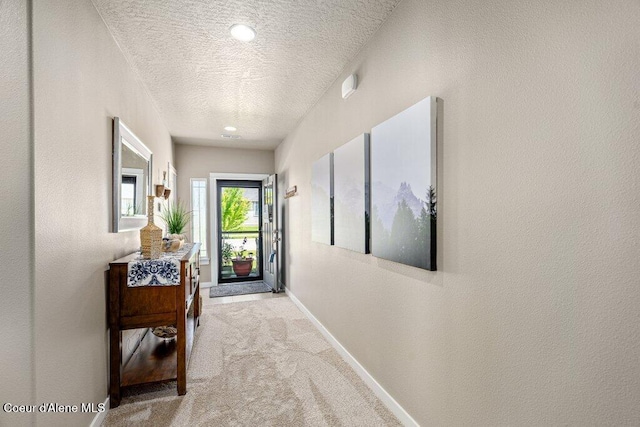 4615 N Connery Loop, Post Falls, ID 83854 - entryway featuring a textured ceiling, carpet floors, baseboards, and a textured wall