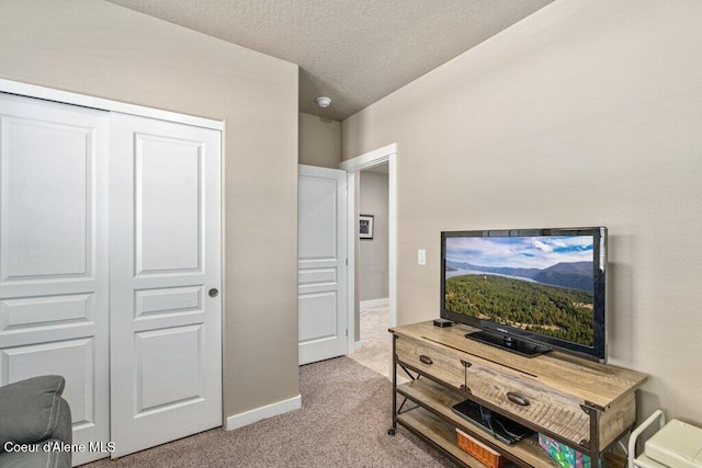 4615 N Connery Loop, Post Falls, ID 83854 - bedroom featuring carpet floors, a textured ceiling, baseboards, and a closet