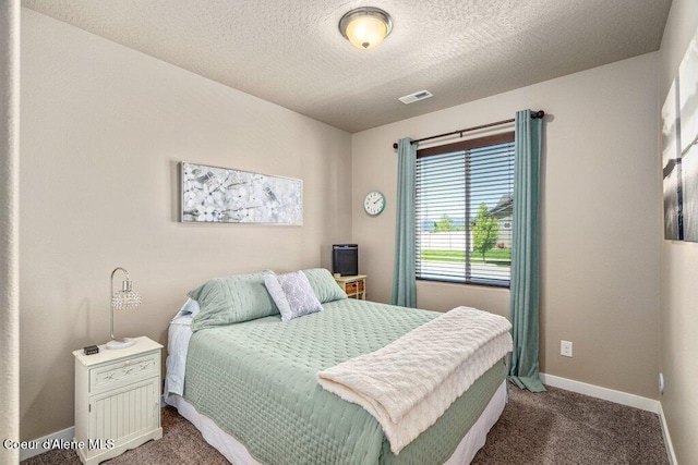 4615 N Connery Loop, Post Falls, ID 83854 - carpeted bedroom with baseboards and a textured ceiling