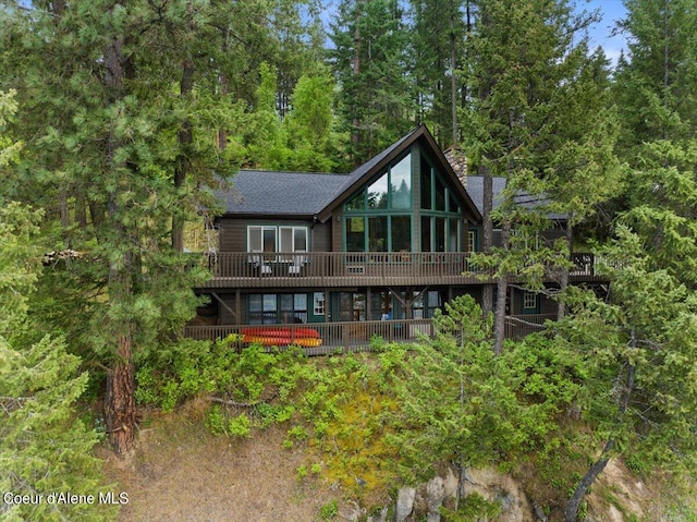 7373 E Hayden Haven Rd, Hayden, ID 83835 - back of house featuring a wooden deck