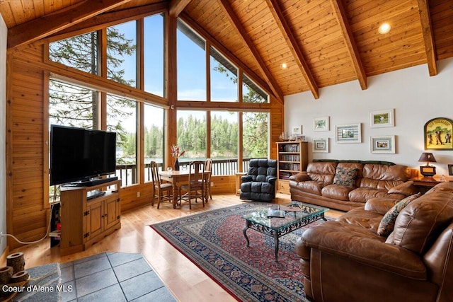 7373 E Hayden Haven Rd, Hayden, ID 83835 - living room featuring wooden ceiling with exposed beams, high vaulted ceiling, and light wood finished floors