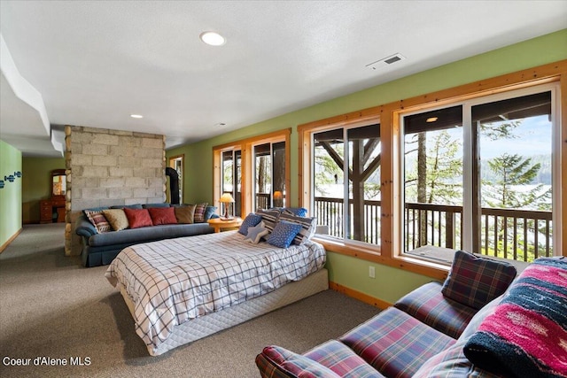 7373 E Hayden Haven Rd, Hayden, ID 83835 - carpeted bedroom with access to exterior, baseboards, and a fireplace