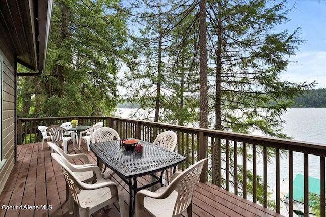 7373 E Hayden Haven Rd, Hayden, ID 83835 - wooden terrace featuring outdoor dining area and a water view