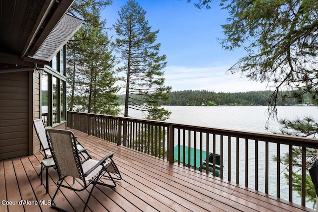 7373 E Hayden Haven Rd, Hayden, ID 83835 - wooden deck featuring a water view and a wooded view