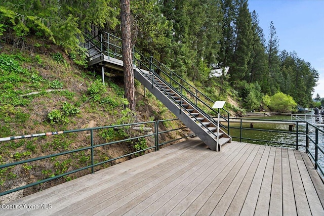 7373 E Hayden Haven Rd, Hayden, ID 83835 - wooden deck featuring stairs and a water view