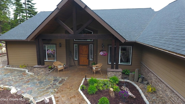 995 S Saddleback Dr, Coeur Dalene, ID 83814 - view of front of house with roof with shingles and covered porch
