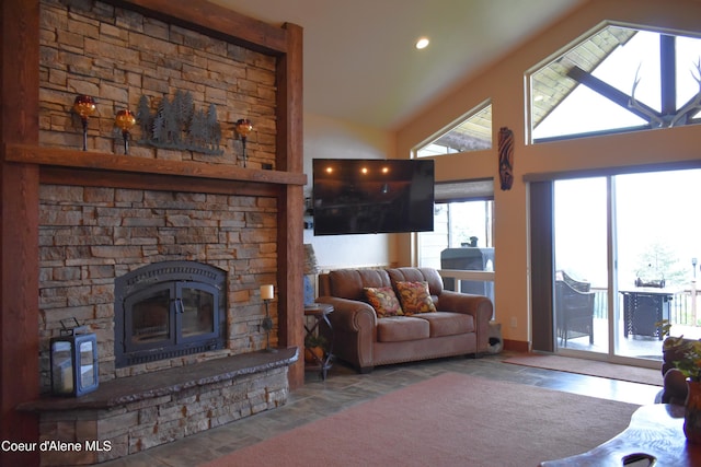 995 S Saddleback Dr, Coeur Dalene, ID 83814 - living area with a fireplace, stone finish floors, high vaulted ceiling, and recessed lighting