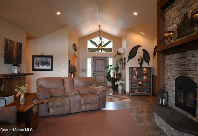 995 S Saddleback Dr, Coeur Dalene, ID 83814 - living area with lofted ceiling, a fireplace, and a chandelier