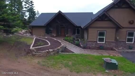 995 S Saddleback Dr, Coeur Dalene, ID 83814 - view of front of property featuring stone siding