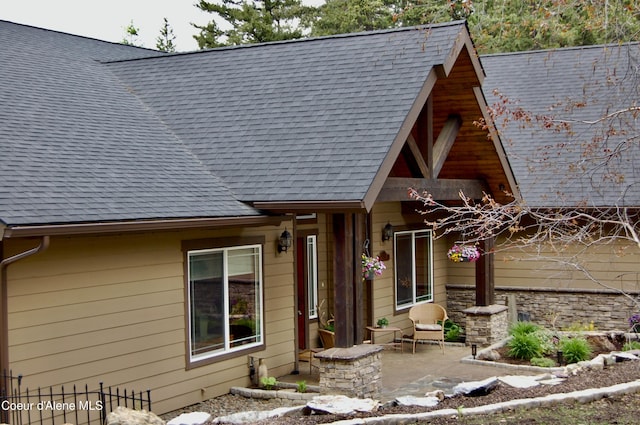 995 S Saddleback Dr, Coeur Dalene, ID 83814 - view of front facade featuring a shingled roof