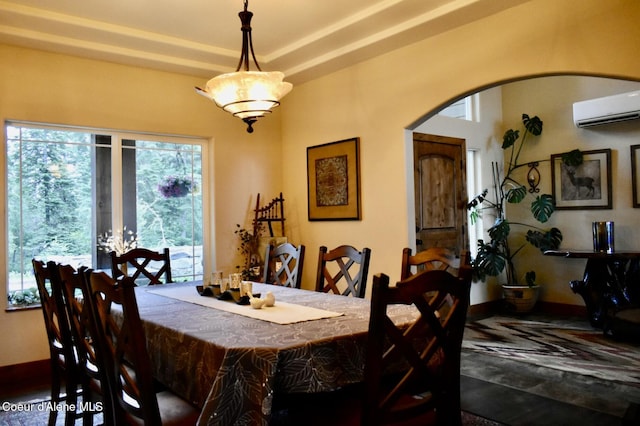 995 S Saddleback Dr, Coeur Dalene, ID 83814 - dining space with a wall unit AC and arched walkways