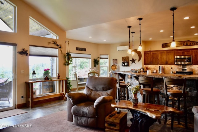 995 S Saddleback Dr, Coeur Dalene, ID 83814 - living room with a wall unit AC, recessed lighting, and baseboards