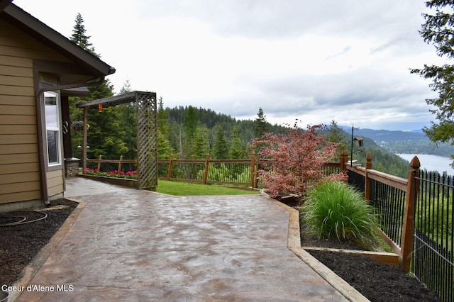 995 S Saddleback Dr, Coeur Dalene, ID 83814 - view of patio / terrace with a mountain view