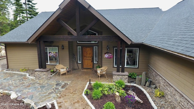 995 S Saddleback Dr, Coeur Dalene, ID 83814 - view of front of house with roof with shingles and covered porch