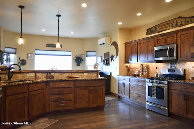 995 S Saddleback Dr, Coeur Dalene, ID 83814 - kitchen featuring appliances with stainless steel finishes, a sink, a wall unit AC, recessed lighting, and decorative backsplash
