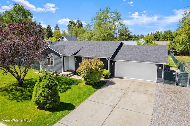 1125 N Shannon Ln, Post Falls, ID 83854 - ranch-style house with a garage, concrete driveway, and a shingled roof