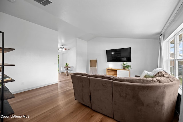 1125 N Shannon Ln, Post Falls, ID 83854 - living room with wood finished floors, lofted ceiling, ceiling fan, and baseboards