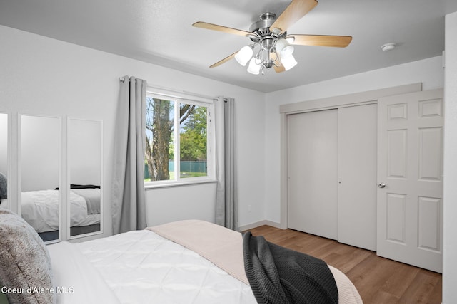 1125 N Shannon Ln, Post Falls, ID 83854 - bedroom with wood finished floors, a closet, and ceiling fan