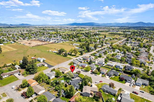 1125 N Shannon Ln, Post Falls, ID 83854 - aerial view of residential area featuring a mountainous background