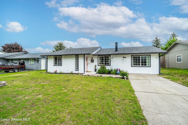 1707 E 2nd Ave, Post Falls, ID 83854 - single story home featuring a front yard, concrete driveway, and a shingled roof