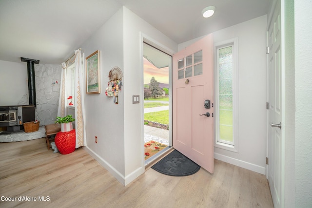1707 E 2nd Ave, Post Falls, ID 83854 - entrance foyer with a wood stove, wood finished floors, and baseboards