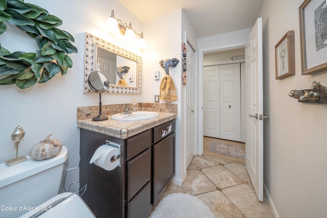 1707 E 2nd Ave, Post Falls, ID 83854 - bathroom featuring vanity, toilet, and tile patterned floors