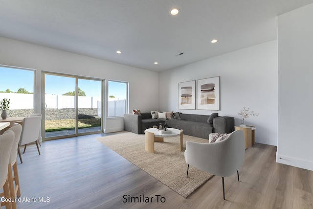 691 N Creative Way, Post Falls, ID 83854 - living room with baseboards, light wood-type flooring, and recessed lighting