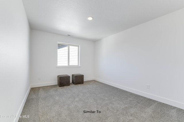 691 N Creative Way, Post Falls, ID 83854 - empty room featuring carpet flooring, baseboards, and recessed lighting
