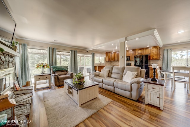 7485 E Revilo Point Rd, Hayden, ID 83835 - living room with crown molding, light wood-style floors, and recessed lighting