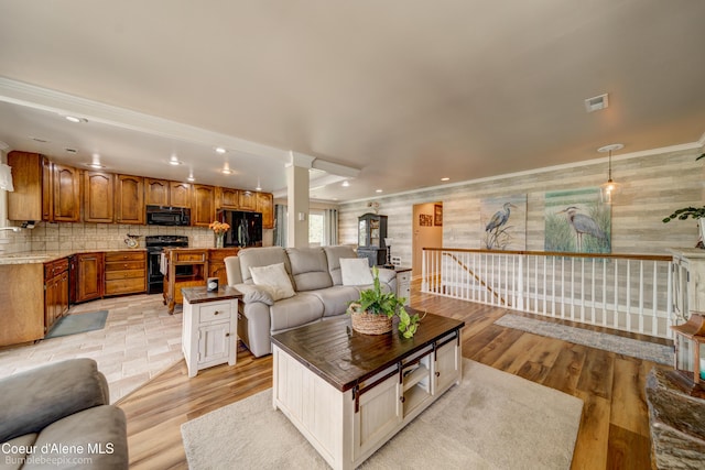 7485 E Revilo Point Rd, Hayden, ID 83835 - living area featuring light wood-style floors, recessed lighting, ornamental molding, and wallpapered walls
