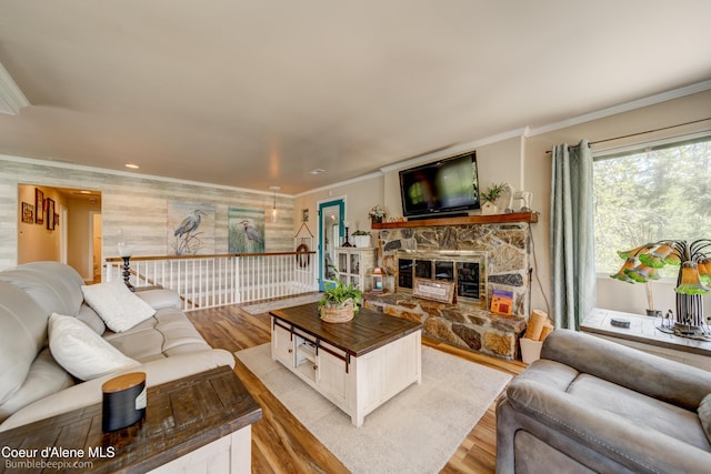 7485 E Revilo Point Rd, Hayden, ID 83835 - living room with light wood-style flooring, crown molding, a fireplace, and recessed lighting