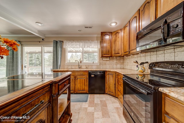 7485 E Revilo Point Rd, Hayden, ID 83835 - kitchen with black appliances, brown cabinets, crown molding, tasteful backsplash, and light stone countertops