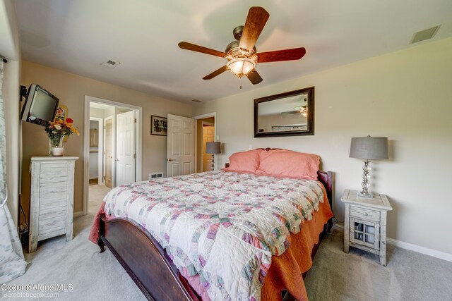 7485 E Revilo Point Rd, Hayden, ID 83835 - bedroom with light carpet, baseboards, and a ceiling fan