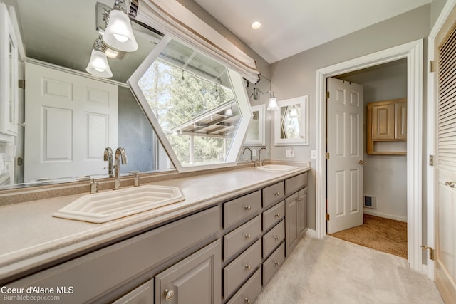 7485 E Revilo Point Rd, Hayden, ID 83835 - full bathroom featuring double vanity and baseboards