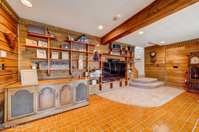 7485 E Revilo Point Rd, Hayden, ID 83835 - living room featuring wooden walls, beamed ceiling, and recessed lighting