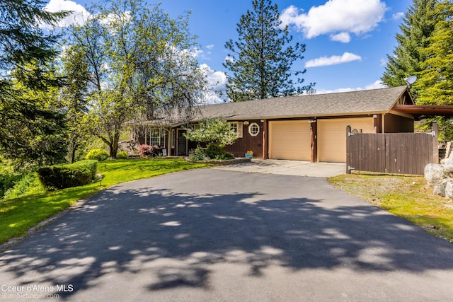 7485 E Revilo Point Rd, Hayden, ID 83835 - single story home with a garage, concrete driveway, and a shingled roof