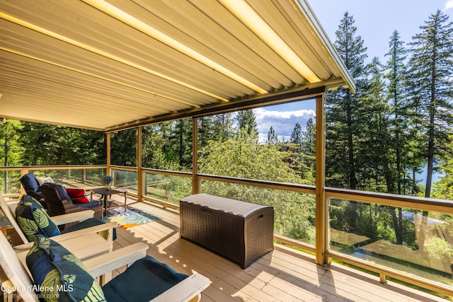 7485 E Revilo Point Rd, Hayden, ID 83835 - wooden deck featuring an outdoor living space and view of scattered trees
